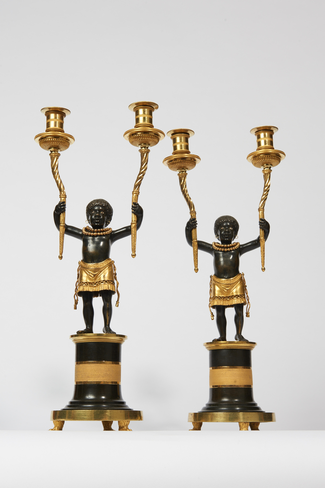 Une paire de candélabres Blackamoor rares