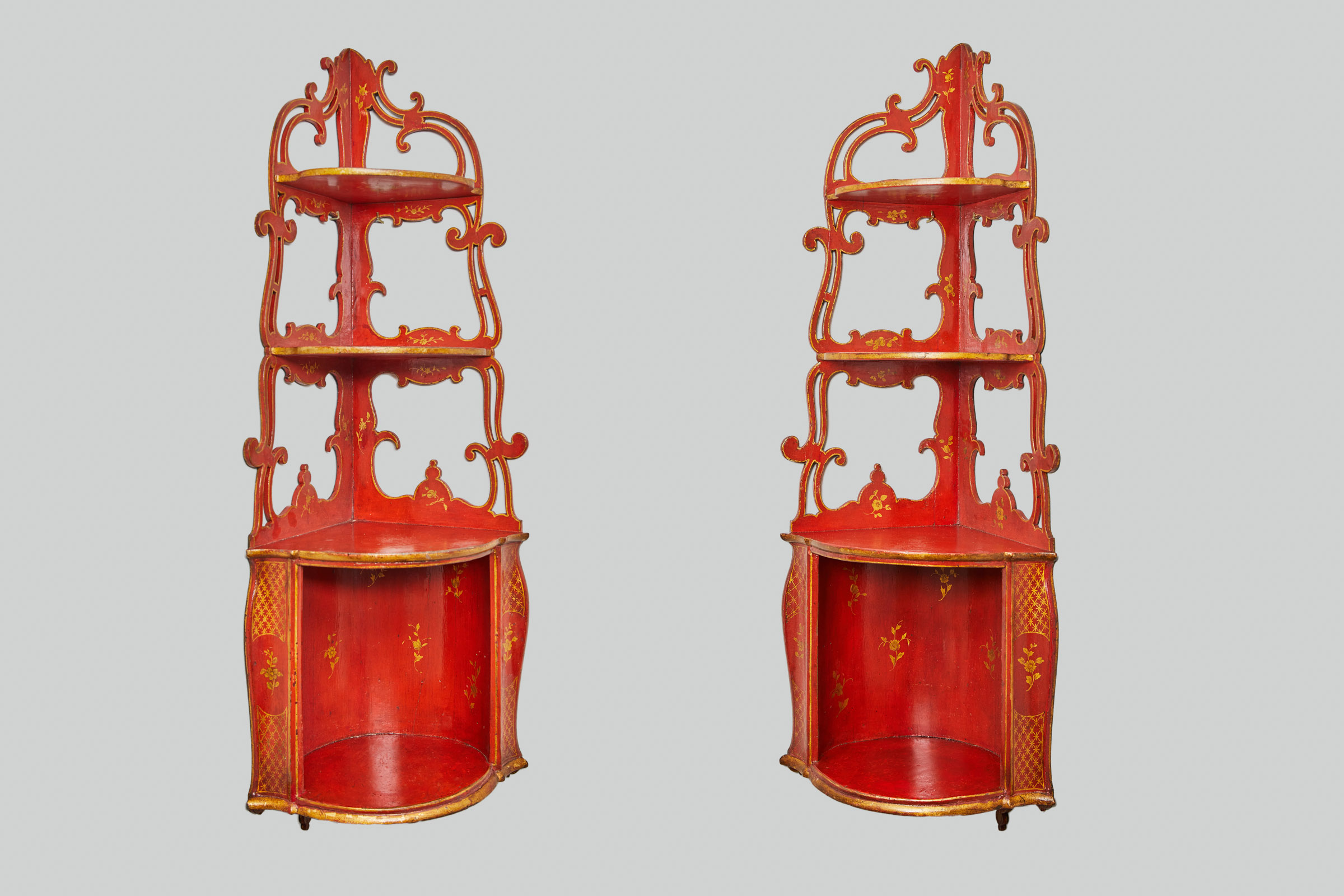 A Pair of Red Lacquer Corner Cabinets